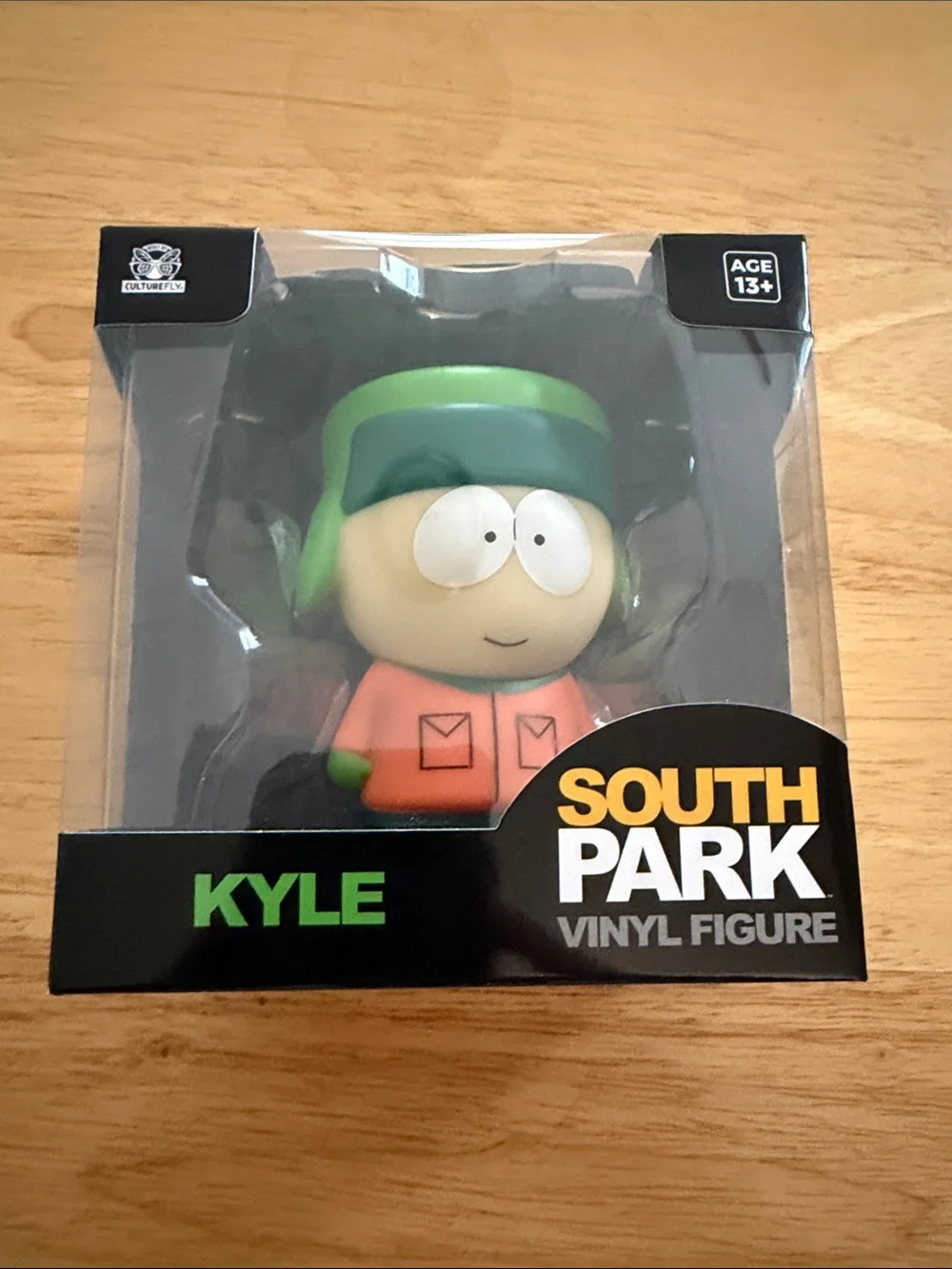 Kyle Vinyl Figure - Green Hat & Orange Jacket